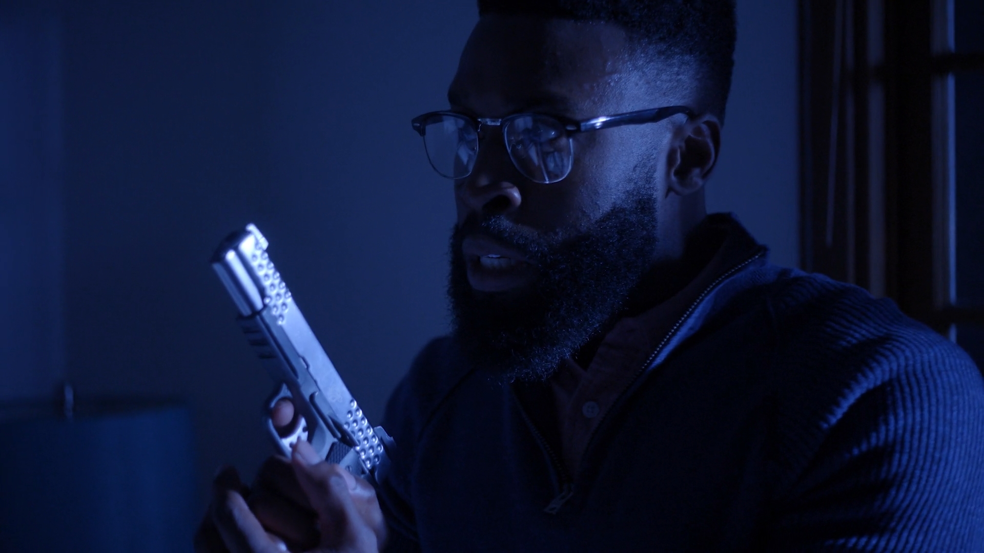 A man holds a gun from It Just Happened